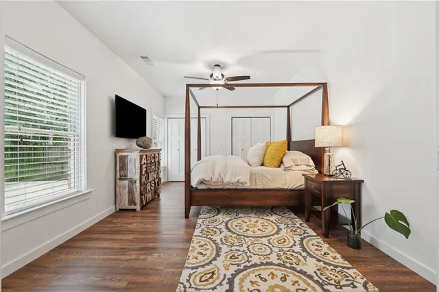 a bedroom with furniture and a window
