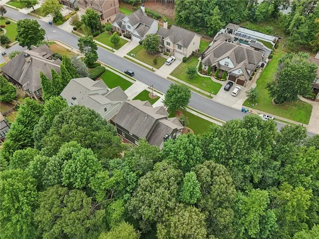 an aerial view of a house with a garden