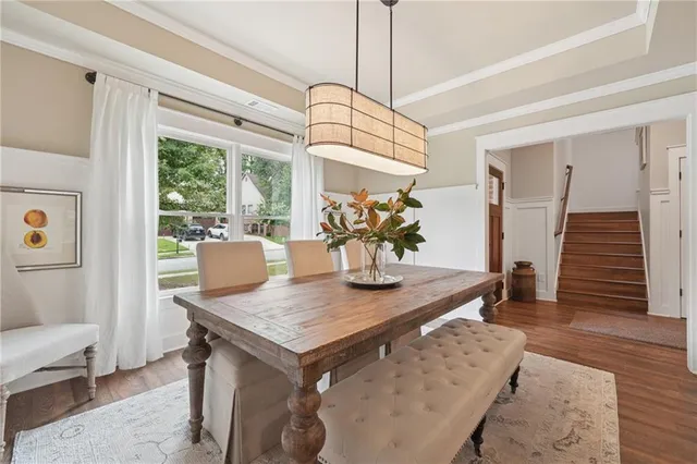 a view of a dining room with furniture window and wooden floor