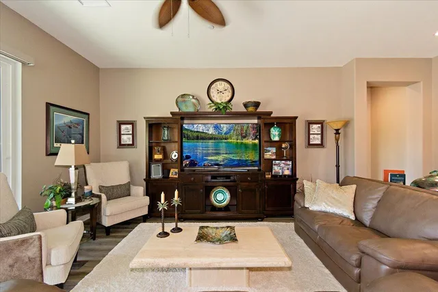 a living room with furniture and a rug