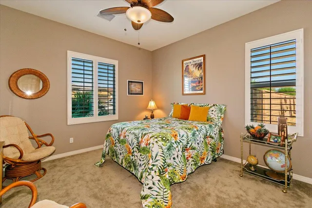 a bedroom with bed and a window