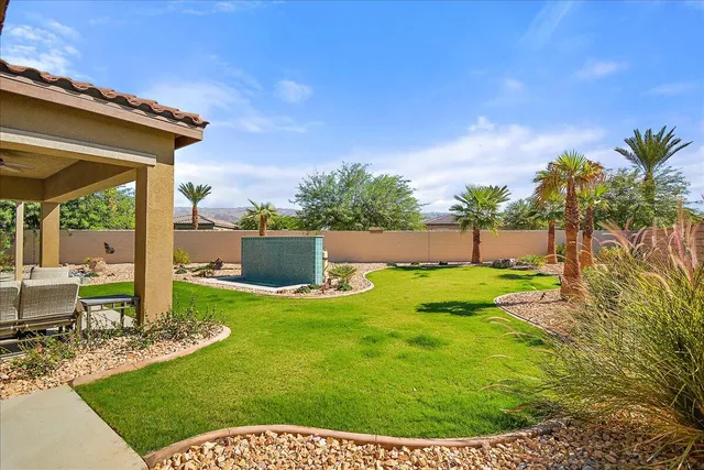 a view of backyard with seating area
