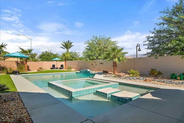 a view of swimming pool with seating space
