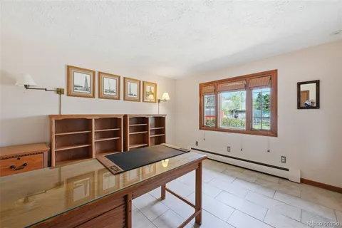 a view of a room with furniture and window
