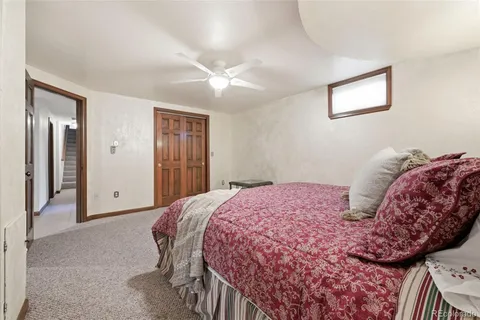 a bedroom with a large bed and closet