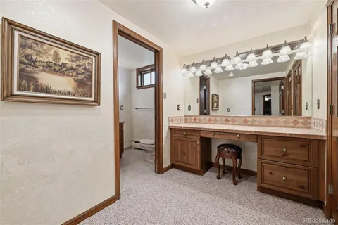 a spacious bathroom with a double vanity sink and a mirror