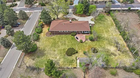 an aerial view of a house with pool yard and outdoor seating