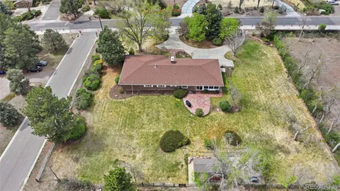 an aerial view of a house with yard