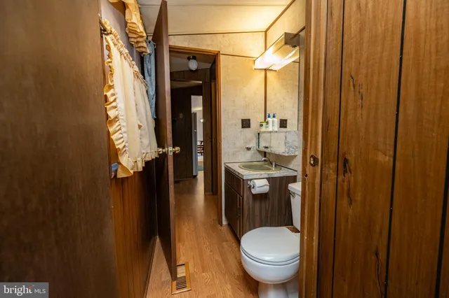 a bedroom with a bed and a walk in closet