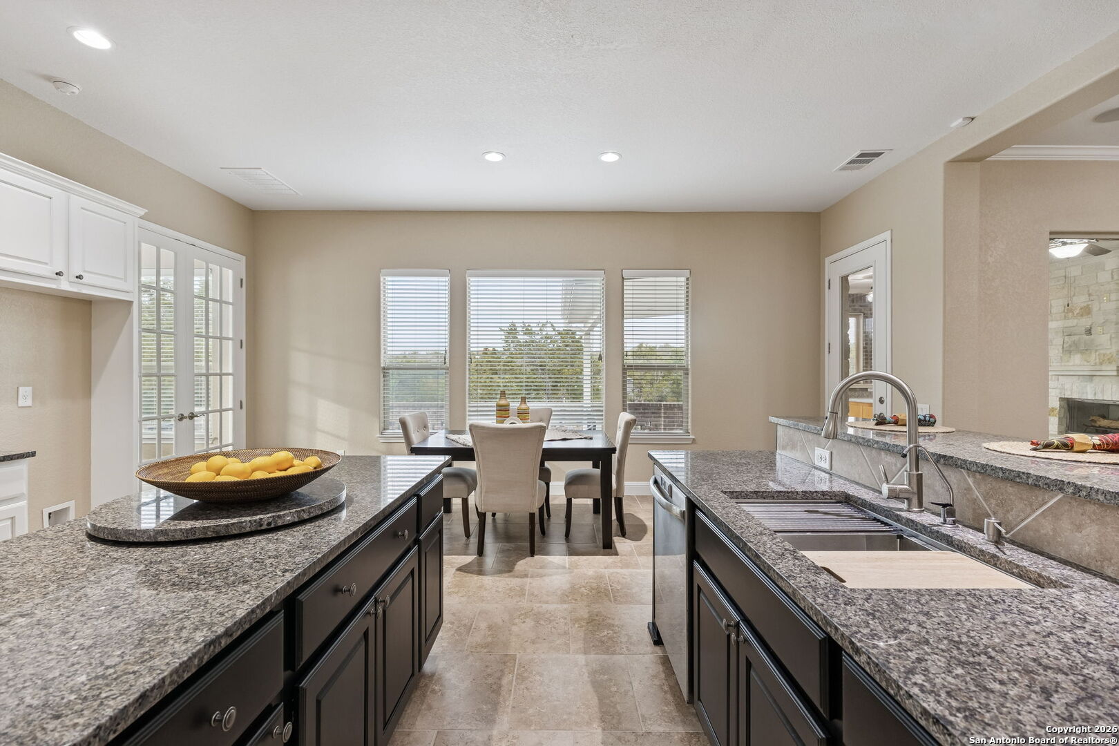 2194 Ranch Loop Drive New Braunfels, TX 78132 - Photo 16 of 52 a kitchen with a granite countertop sink and stove