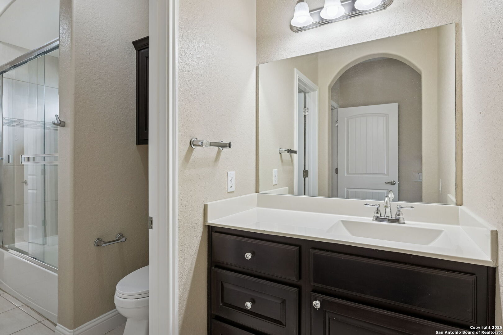 2194 Ranch Loop Drive New Braunfels, TX 78132 - Photo 30 of 52 a bathroom with a sink a toilet and a mirror