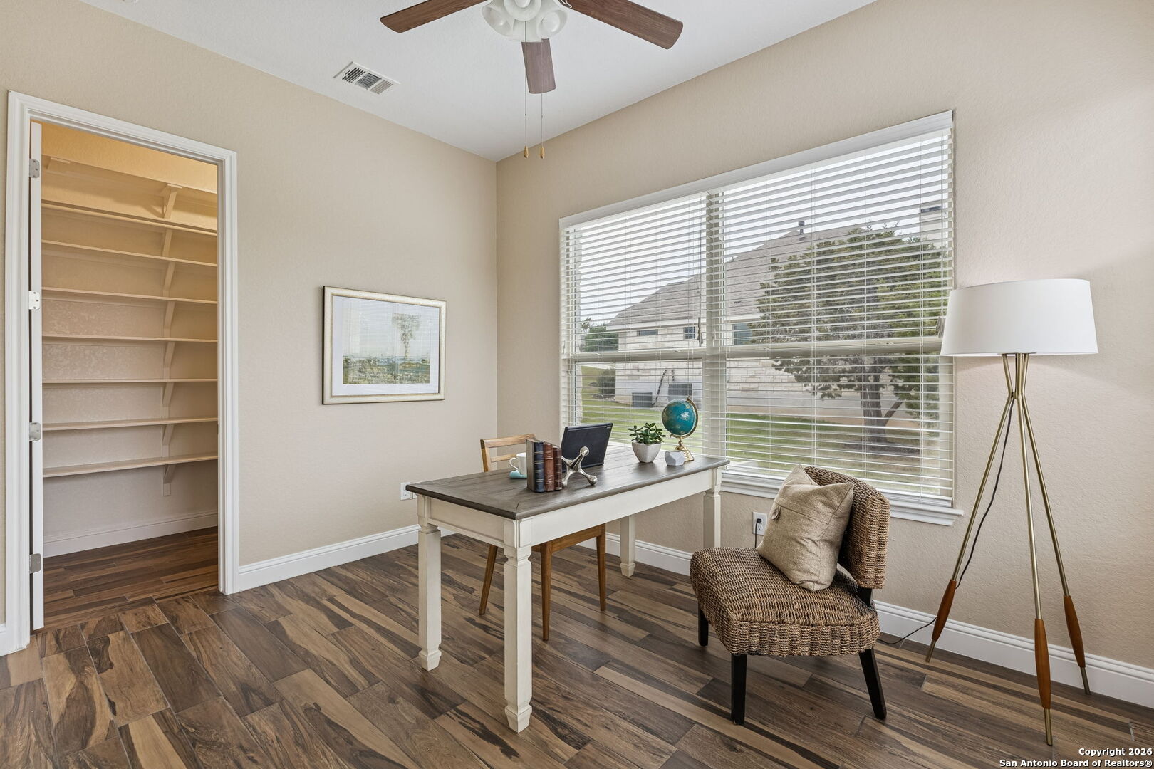 2194 Ranch Loop Drive New Braunfels, TX 78132 - Photo 32 of 52 a workspace with wooden floor and a window