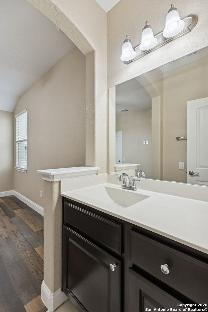 2194 Ranch Loop Drive New Braunfels, TX 78132 - Photo 34 of 52 a bathroom with a sink a vanity and a mirror