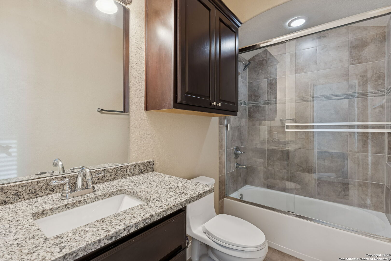 2194 Ranch Loop Drive New Braunfels, TX 78132 - Photo 35 of 52 a bathroom with a granite countertop sink toilet and shower