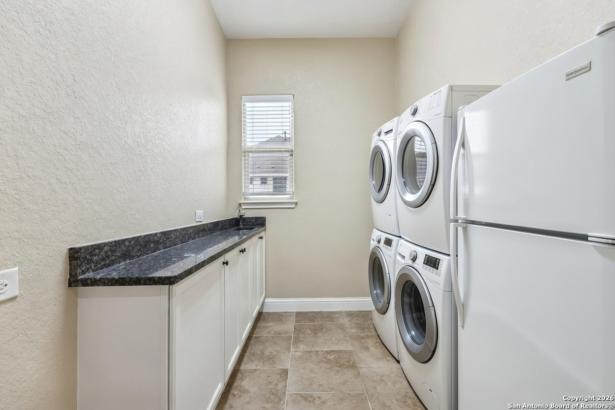 2194 Ranch Loop Drive New Braunfels, TX 78132 - Photo 45 of 52 a utility room with dryer and washer