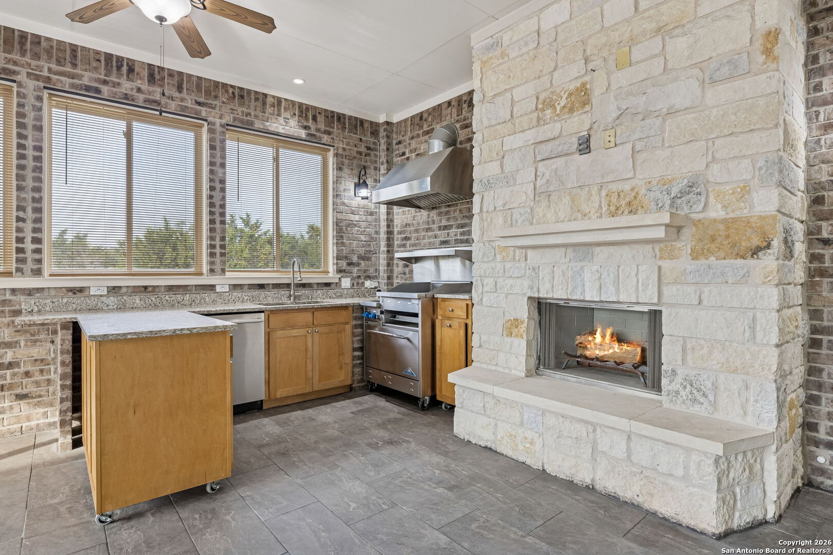 2194 Ranch Loop Drive New Braunfels, TX 78132 - Photo 47 of 52 a kitchen with a fireplace and a counter top space