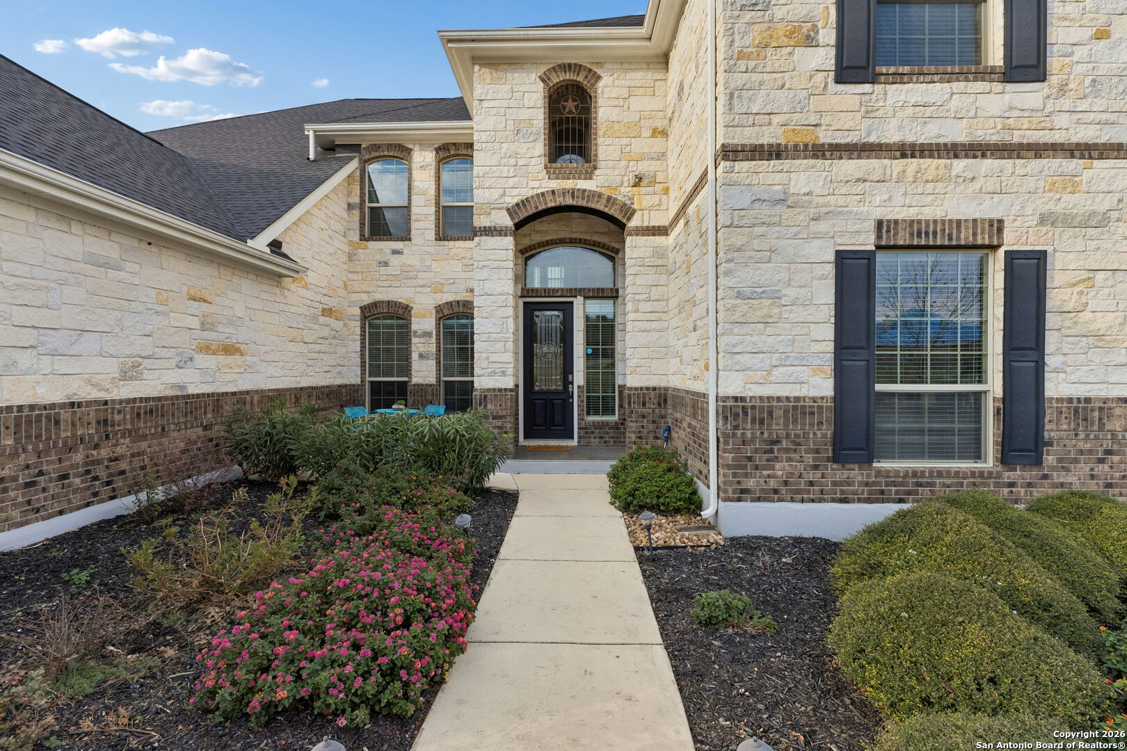 2194 Ranch Loop Drive New Braunfels, TX 78132 - Photo 5 of 52 a front view of a house with garden