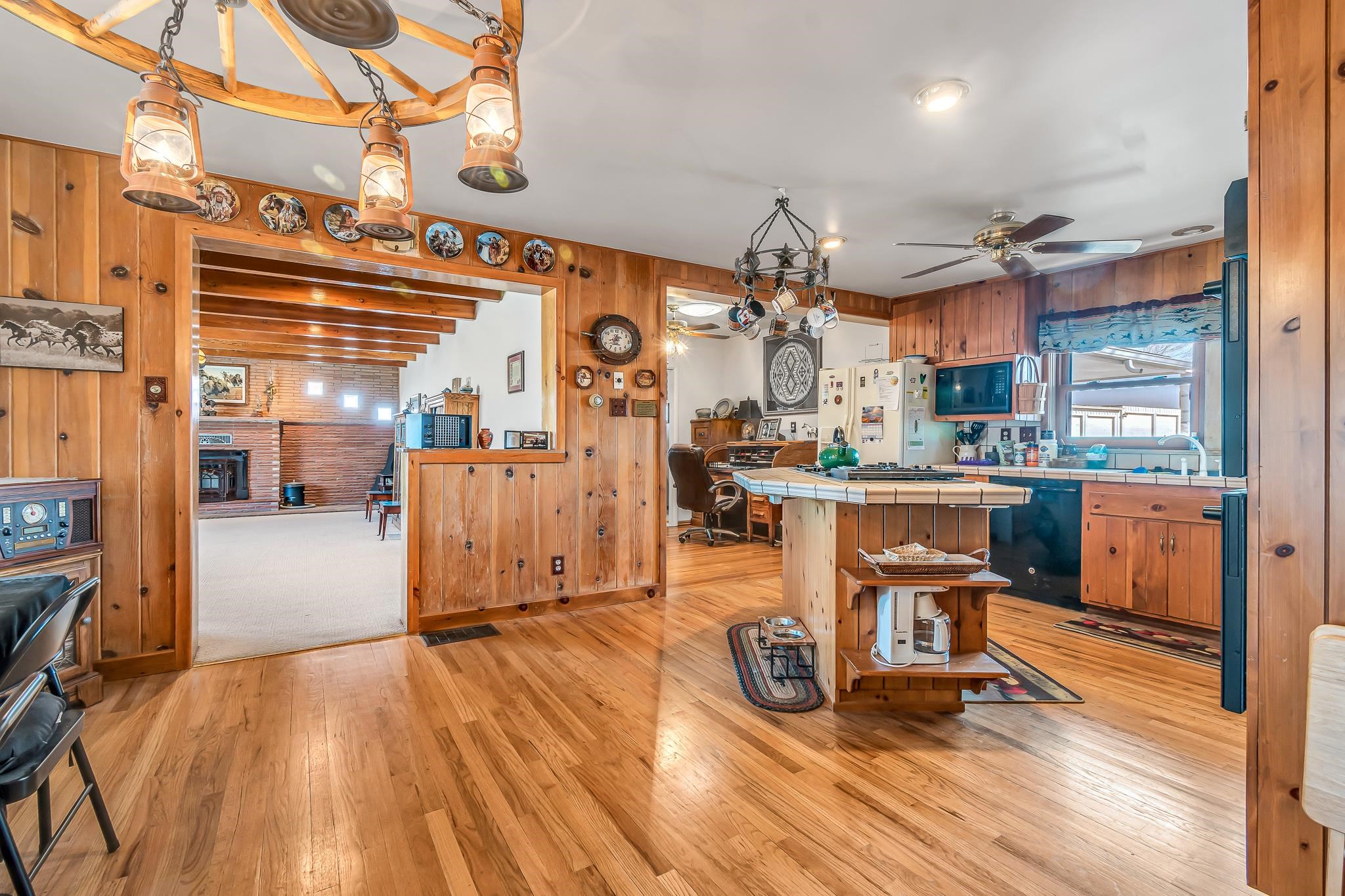 1024 24 Road Grand Junction, CO 81505 - Photo 16 of 42 a living room with lots of furniture and kitchen view