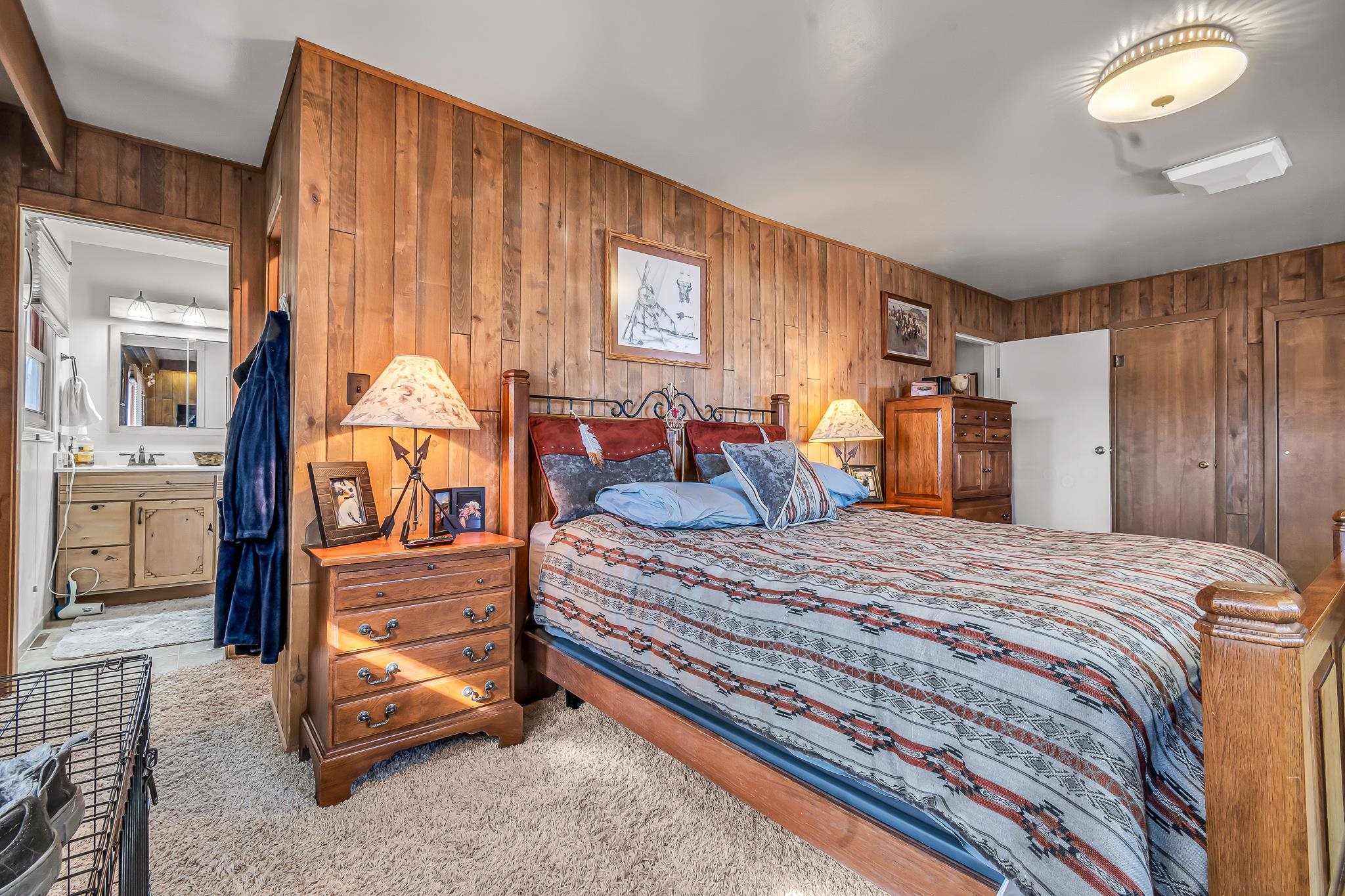 1024 24 Road Grand Junction, CO 81505 - Photo 24 of 42 a bedroom with a bed and dresser with mirror