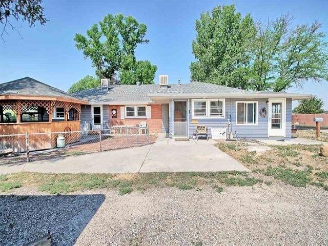 1024 24 Road Grand Junction, CO 81505 - Photo 40 of 42 front view of a house with a yard