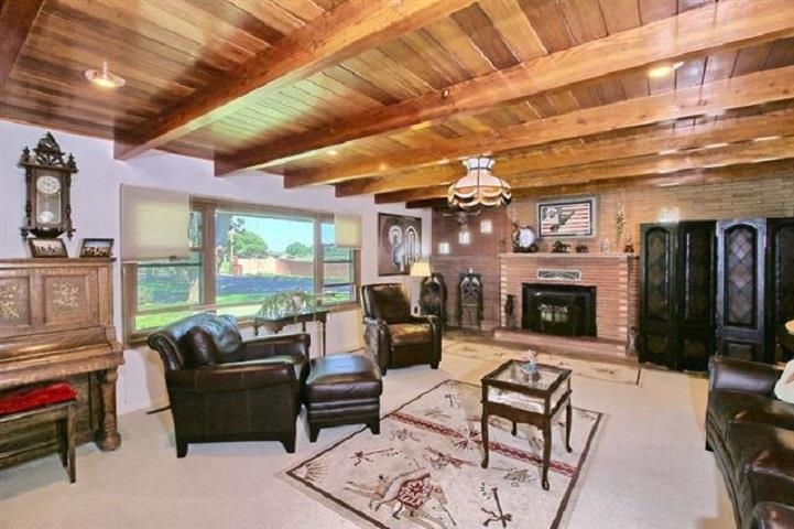 1024 24 Road Grand Junction, CO 81505 - Photo 4 of 42 a living room with furniture a fireplace and a table