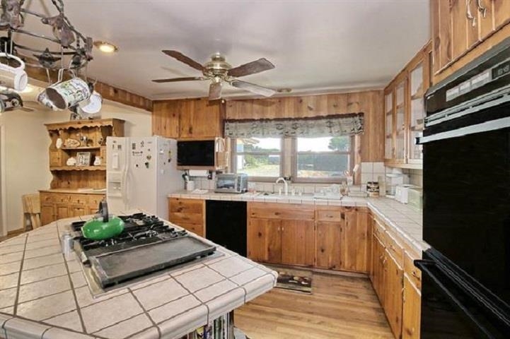 1024 24 Road Grand Junction, CO 81505 - Photo 9 of 42 a kitchen with stainless steel appliances a stove a sink and a refrigerator