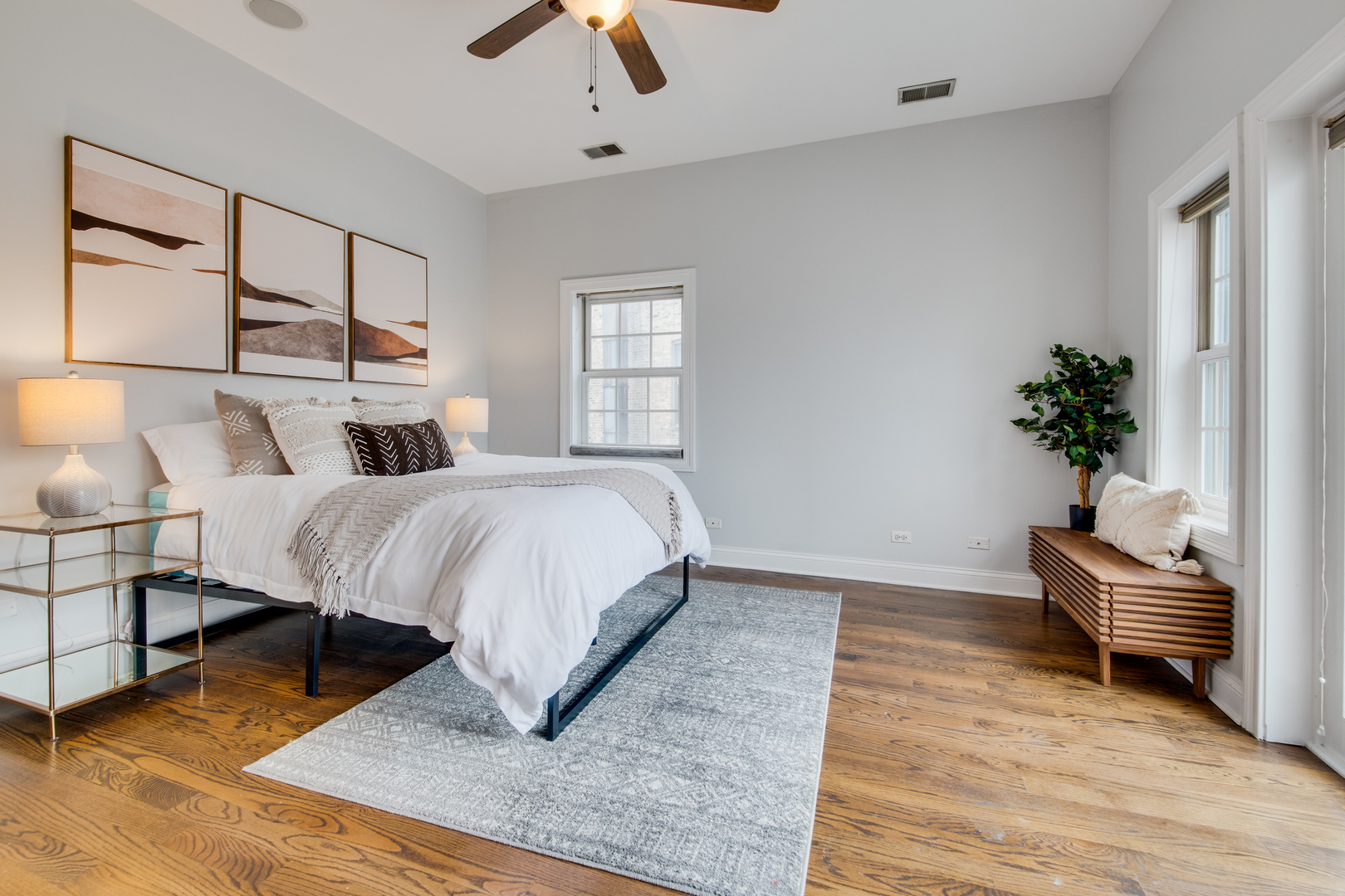 4146 North Lincoln Avenue, Unit 3 Chicago, IL 60618 - Photo 20 of 32 a bed room with a bed and a potted plant