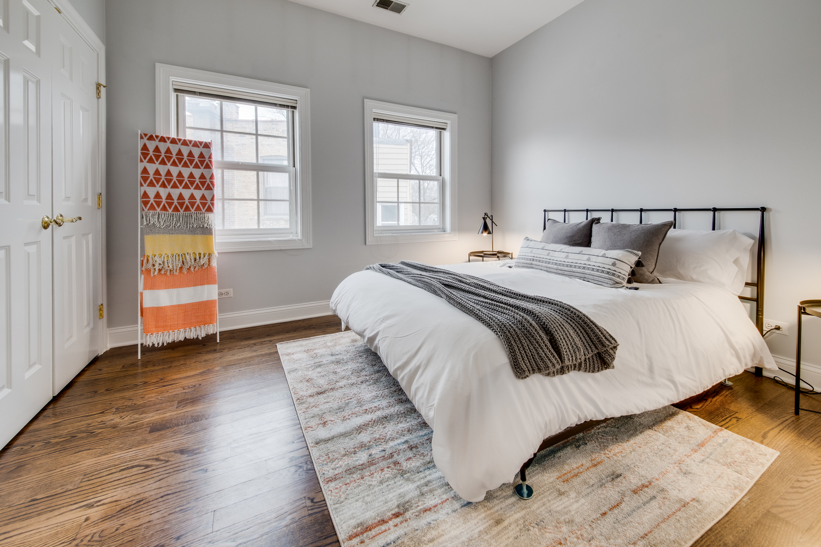 4146 North Lincoln Avenue, Unit 3 Chicago, IL 60618 - Photo 24 of 32 a bedroom with a bed and wooden floor