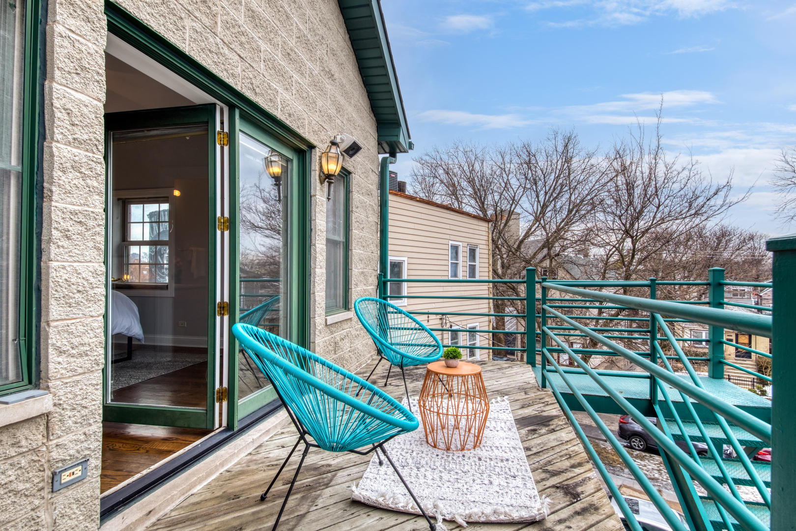 4146 North Lincoln Avenue, Unit 3 Chicago, IL 60618 - Photo 28 of 32 a balcony with wooden floor and outdoor seating