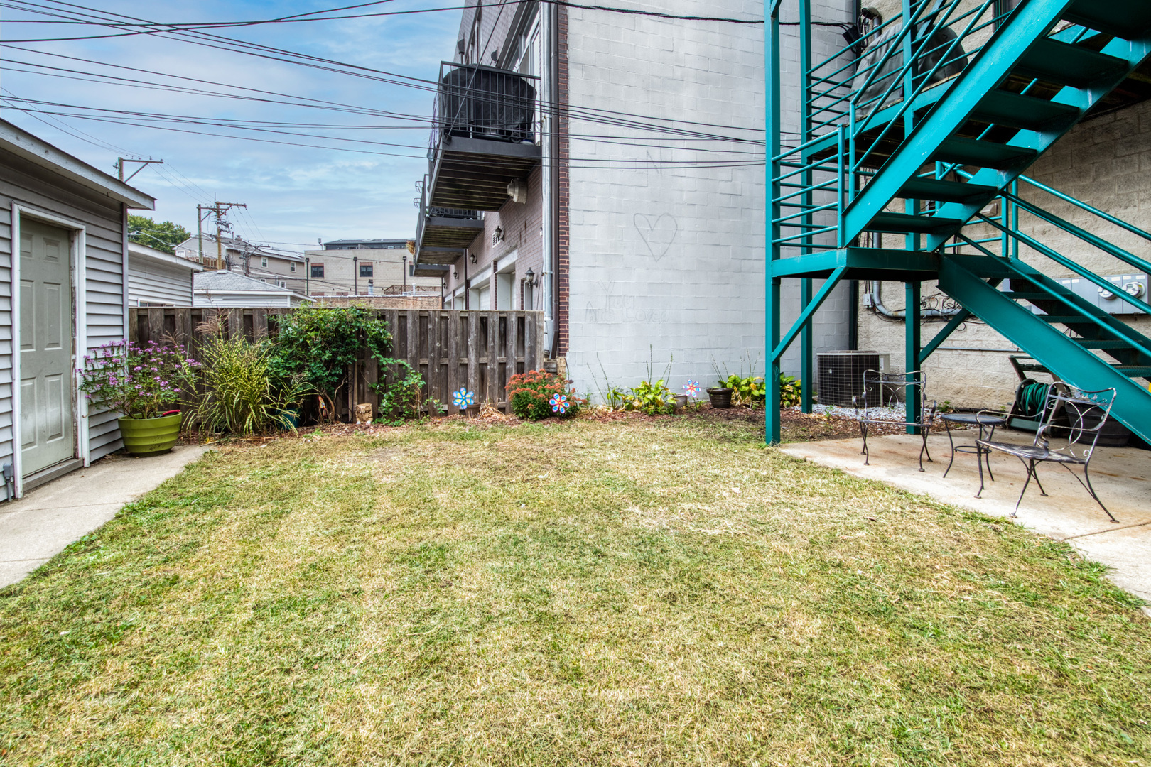 4146 North Lincoln Avenue, Unit 3 Chicago, IL 60618 - Photo 30 of 32 a view of house with yard and staircase