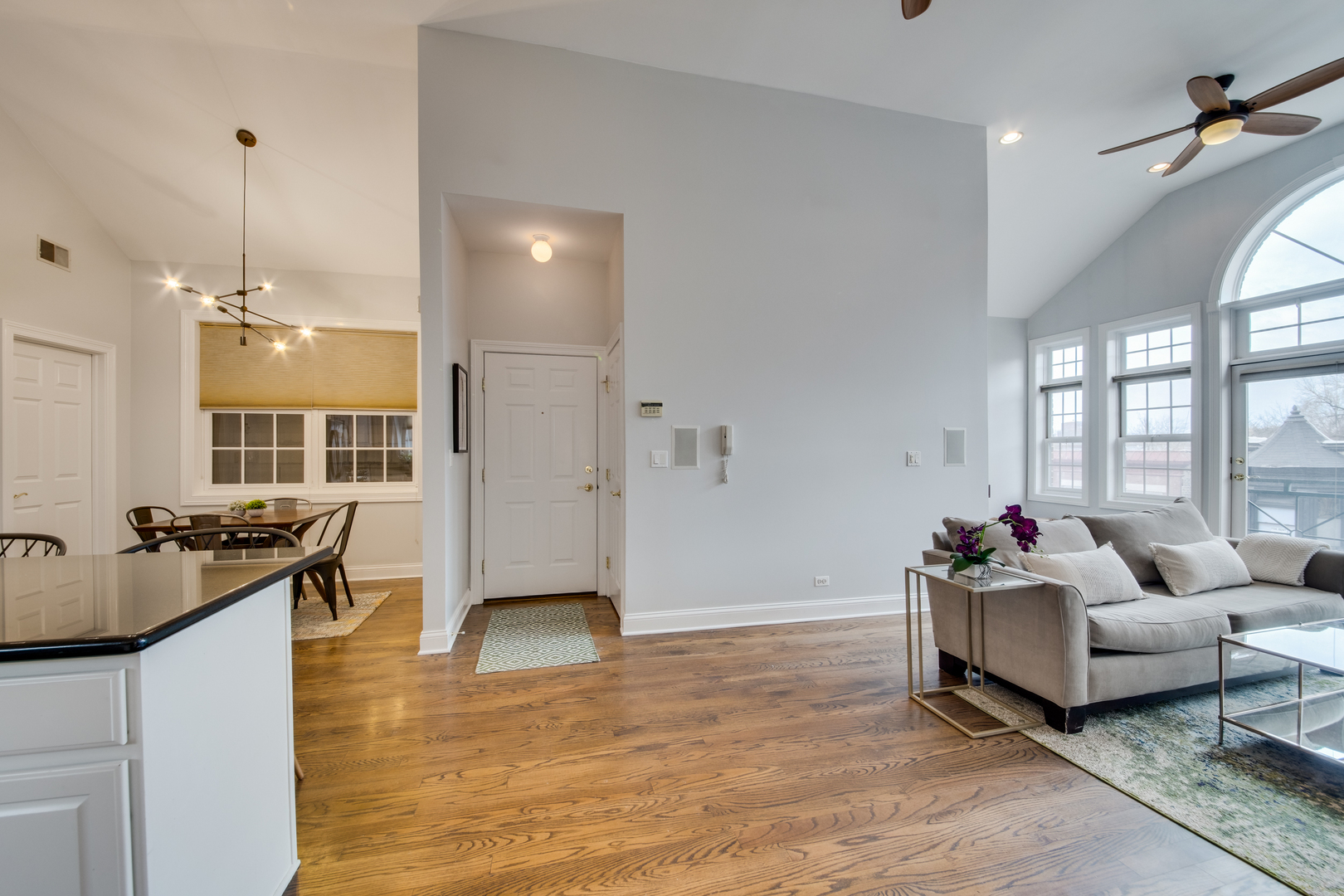 4146 North Lincoln Avenue, Unit 3 Chicago, IL 60618 - Photo 9 of 32 a living room with furniture and wooden floor