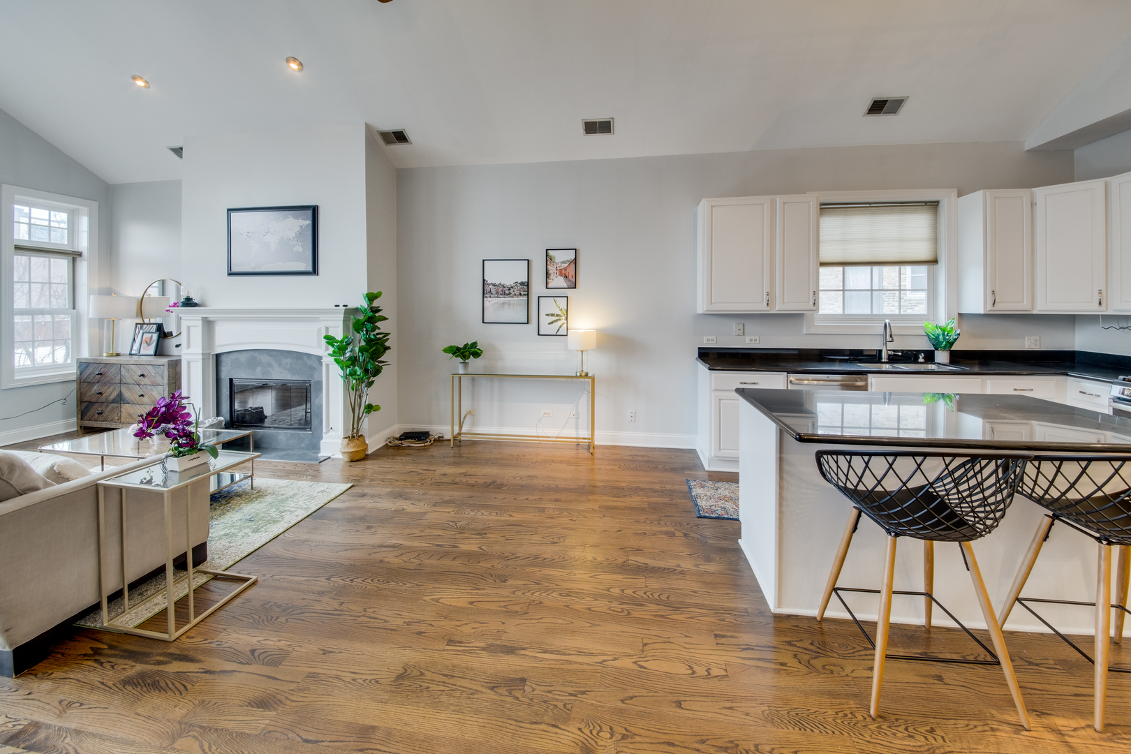 4146 North Lincoln Avenue, Unit 3 Chicago, IL 60618 - Photo 10 of 32 a kitchen with granite countertop a stove a sink and a refrigerator