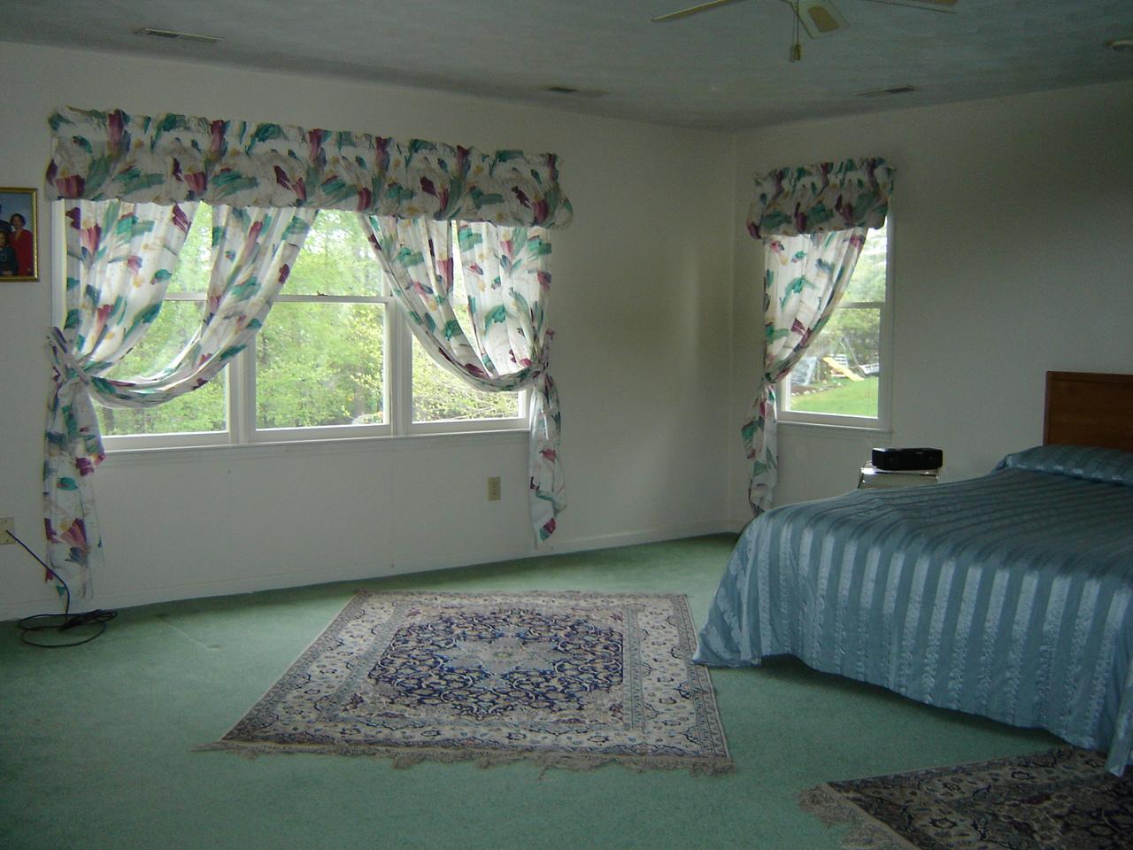 241 Stonehaven Lane Blue Ridge, VA 24064 - Photo 12 of 18 a bedroom with a bed and a window