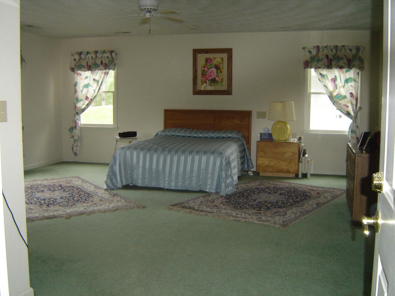 241 Stonehaven Lane Blue Ridge, VA 24064 - Photo 13 of 18 a bedroom with a bed and a window