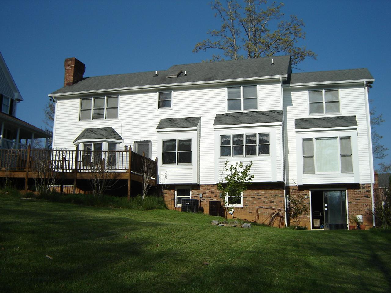 241 Stonehaven Lane Blue Ridge, VA 24064 - Photo 17 of 18 a front view of a house with a garden
