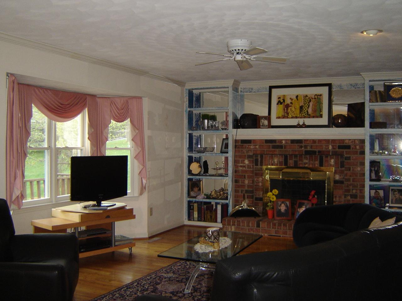 241 Stonehaven Lane Blue Ridge, VA 24064 - Photo 4 of 18 a living room with furniture a flat screen tv and a fireplace