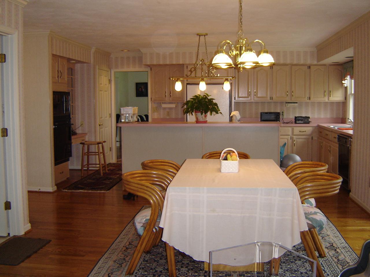 241 Stonehaven Lane Blue Ridge, VA 24064 - Photo 5 of 18 a view of a dining room with furniture and a chandelier