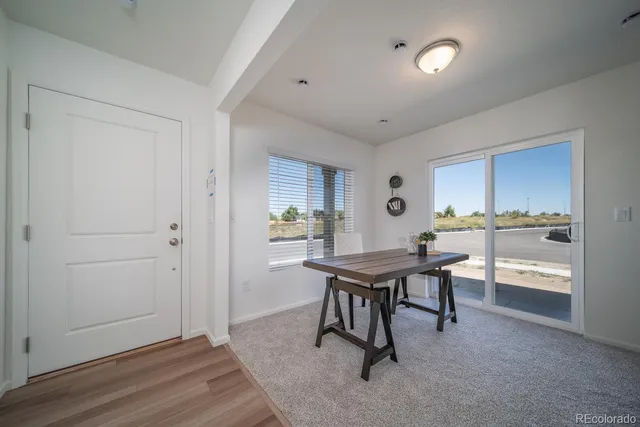 a view of a kitchen and dining room