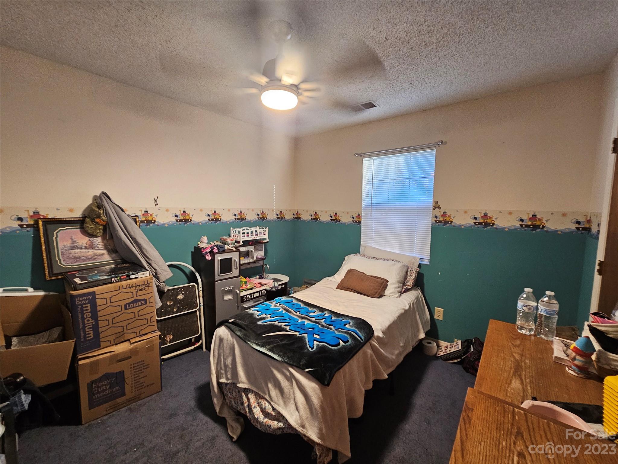 5361 Crawford Road Fort Lawn, SC 29714 - Photo 11 of 15 a bed room with a bed and a chair