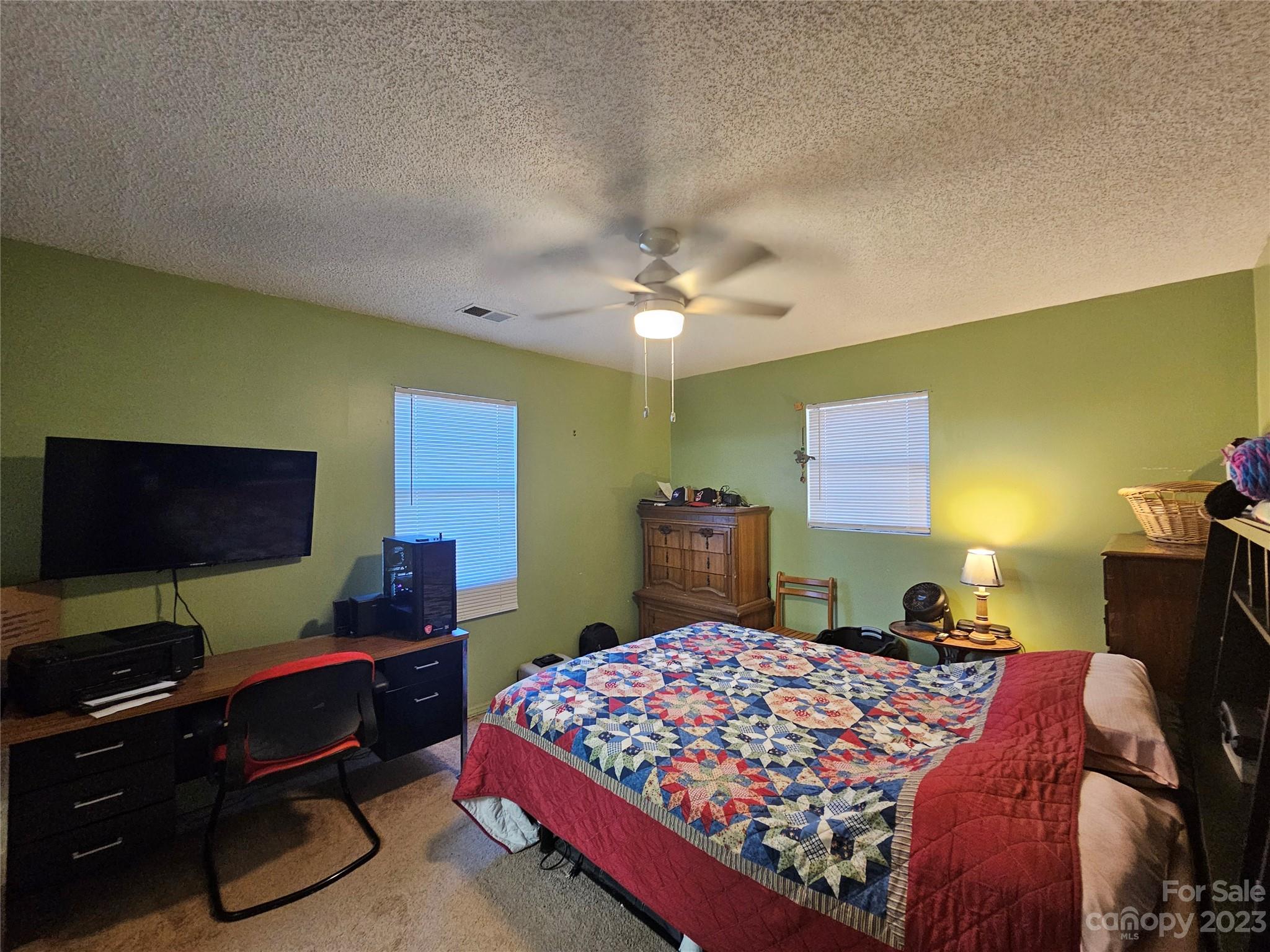 5361 Crawford Road Fort Lawn, SC 29714 - Photo 8 of 15 a bedroom with a bed and a flat screen tv