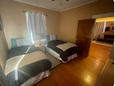 a view of living room with furniture and a mirror