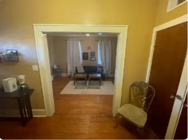 a view of a house with backyard and porch