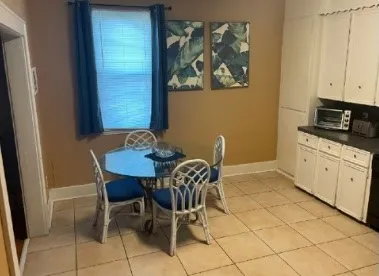 a view of a dining room with furniture