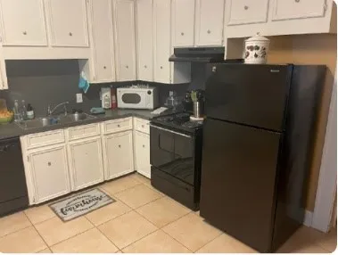 a view of a closet area with wooden floor