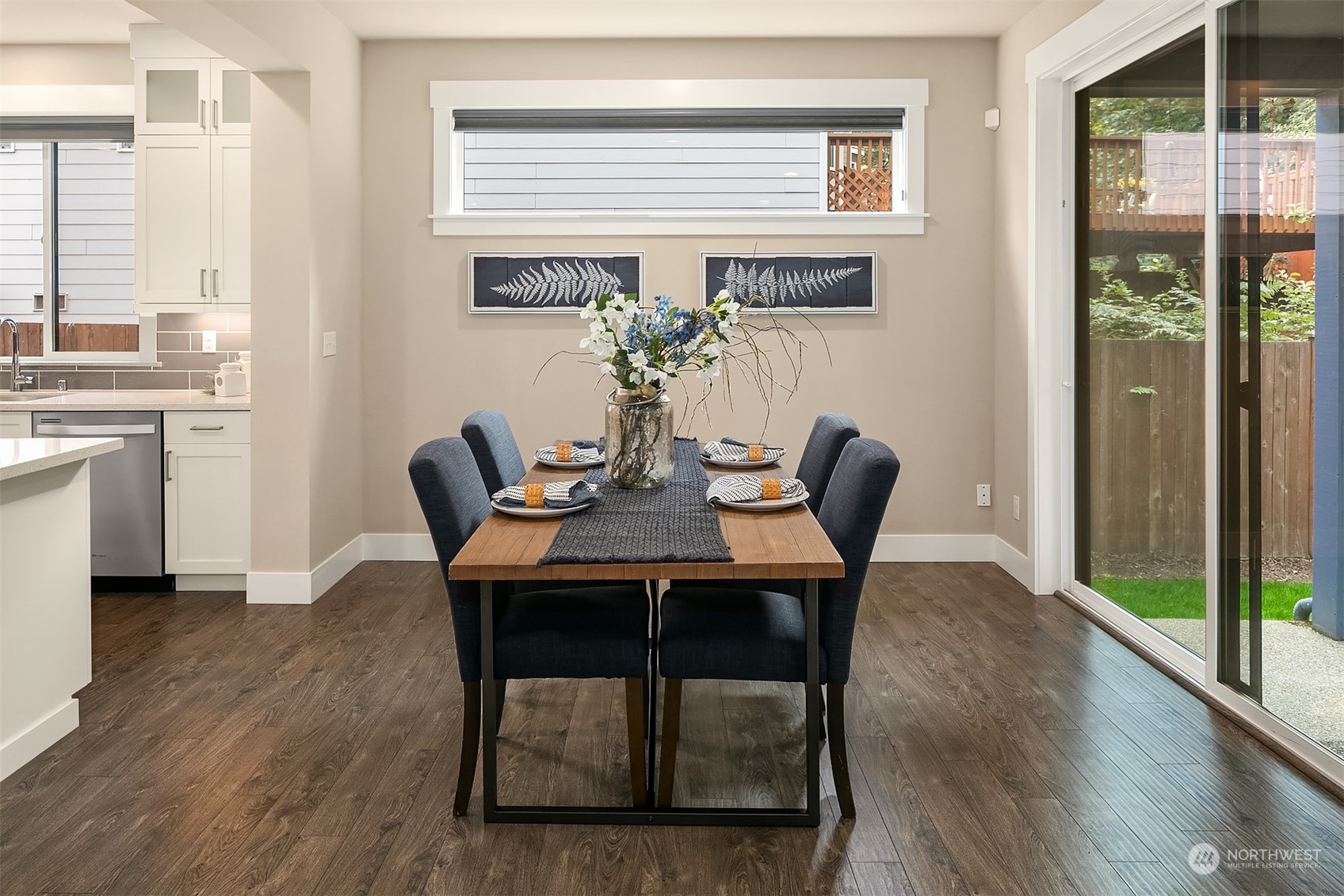 4126 230th Place Southeast Bothell, WA 98021 - Photo 12 of 33 a view of a dining room with furniture window and wooden floor