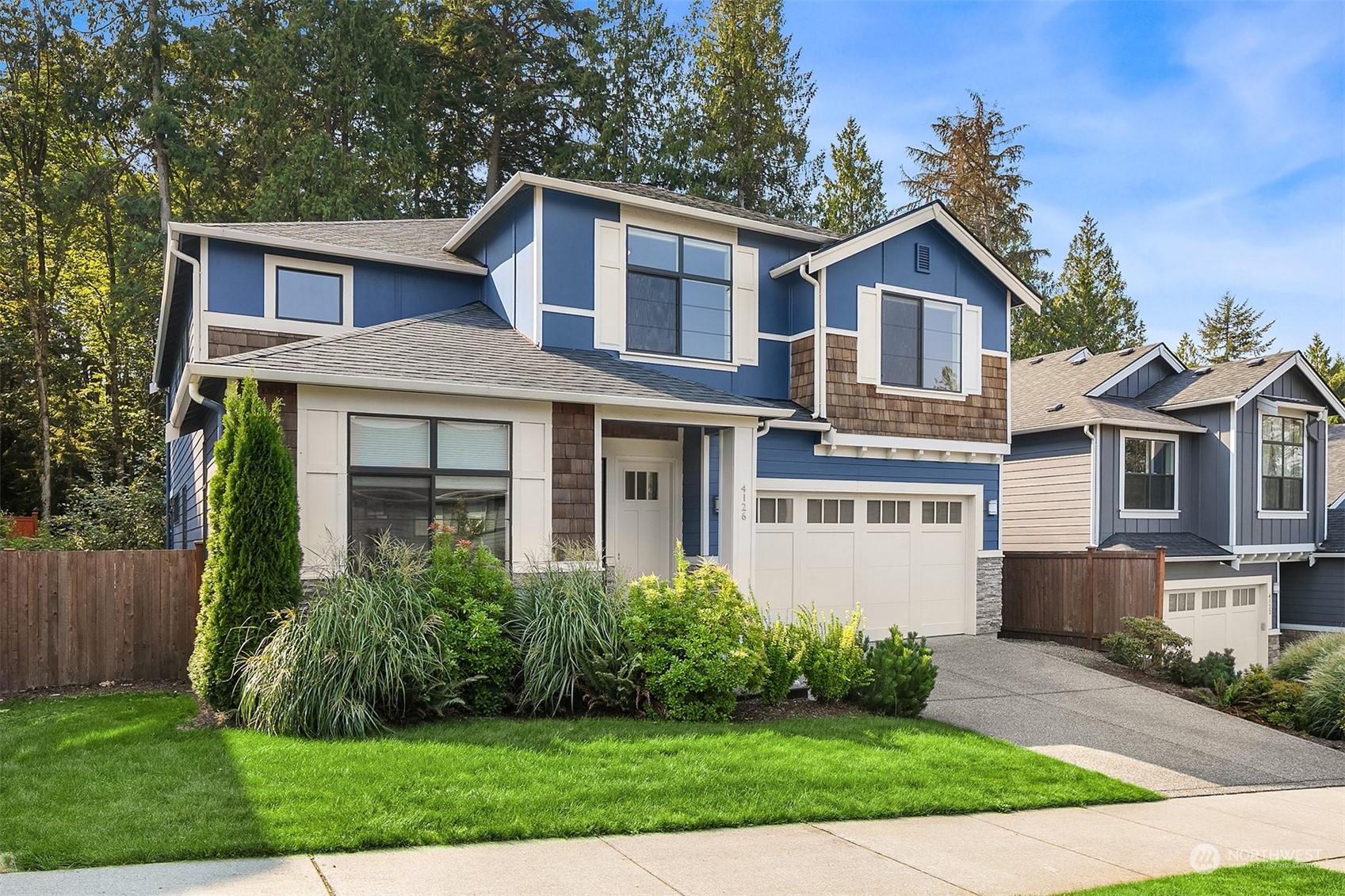 4126 230th Place Southeast Bothell, WA 98021 - Photo 31 of 33 a front view of a house with a yard
