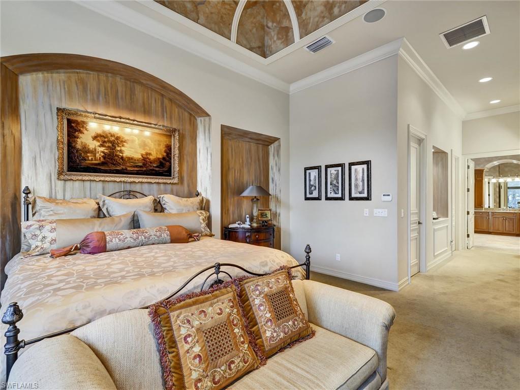 9113 Terrabella Court Naples, FL 34109 - Photo 27 of 47 a bedroom with furniture and a flat screen tv