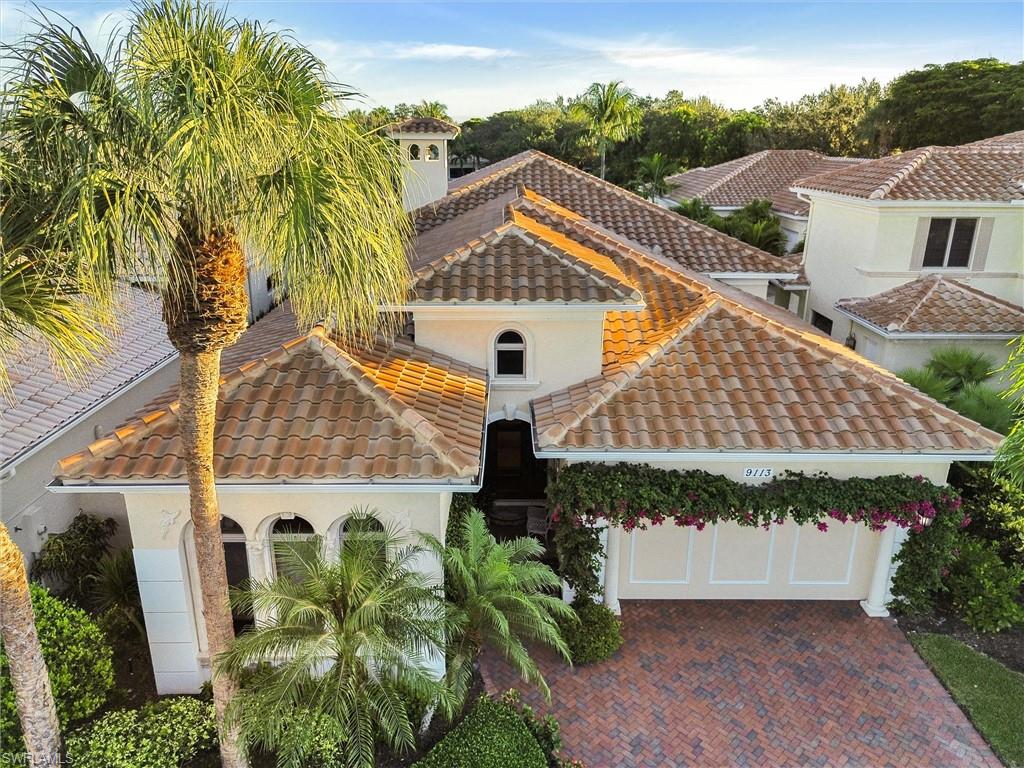 9113 Terrabella Court Naples, FL 34109 - Photo 3 of 47 an aerial view of a house with a yard