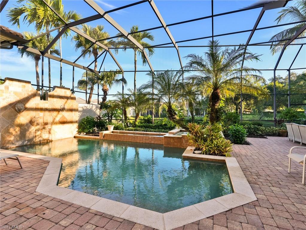 9113 Terrabella Court Naples, FL 34109 - Photo 41 of 47 a view of a swimming pool with a patio
