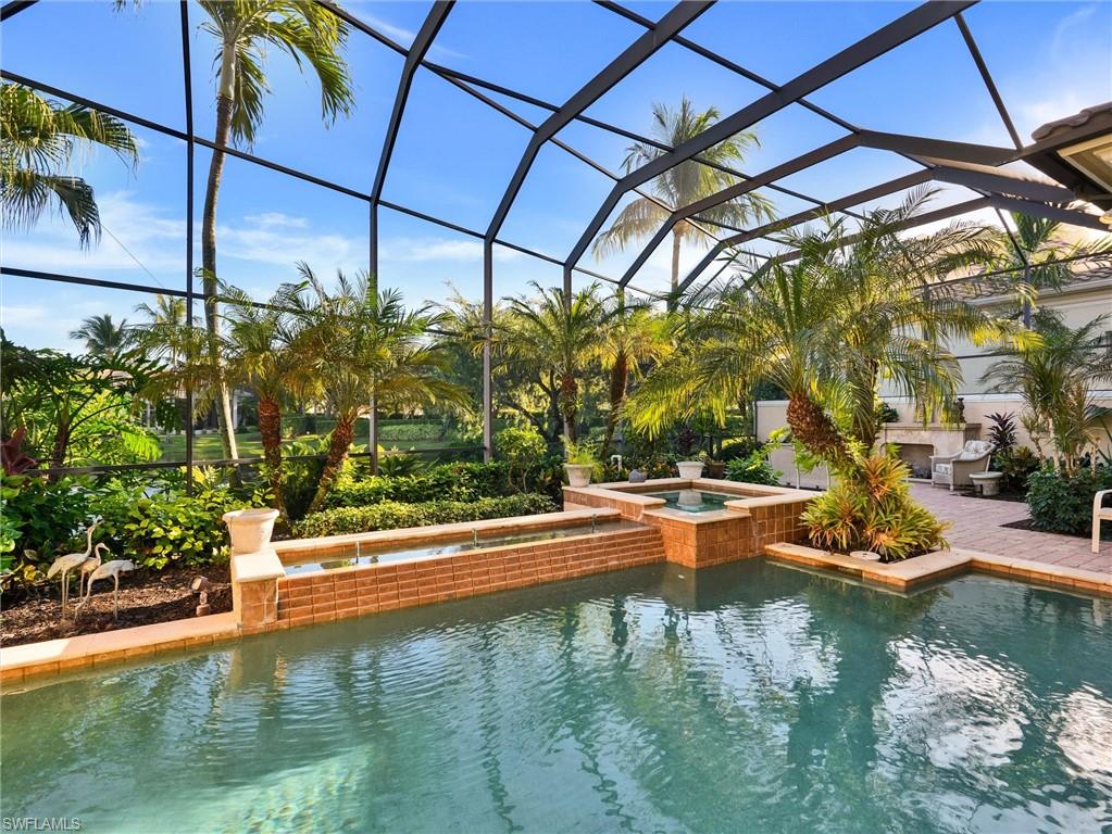 9113 Terrabella Court Naples, FL 34109 - Photo 43 of 47 a view of swimming pool with a yard